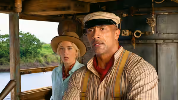 Frank Wolff (Dwayne Johnson) and Dr. Lily Houghton (Emily Blunt) stand aboard a riverboat