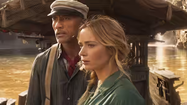 Frank Wolff (Dwayne Johnson) and Dr. Lily Houghton (Emily Blunt) watch from a riverboat