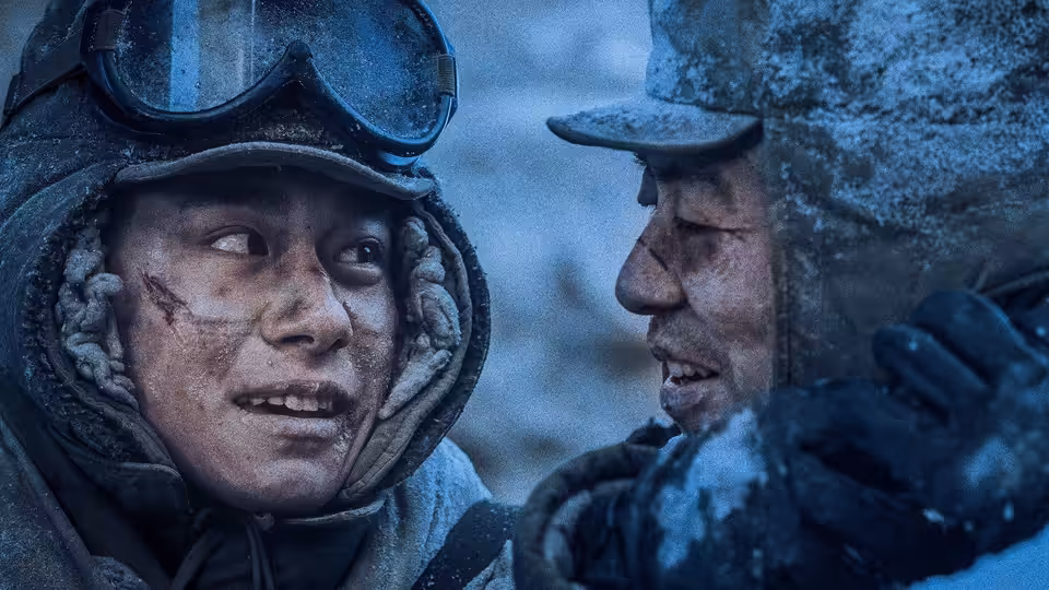 Two frost-covered soldiers in winter gear face each other on a snowy battlefield