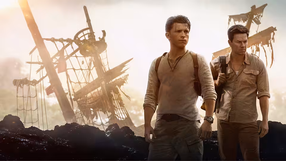 Young Nate (Tiernan Jones) and Young Sam (Rudy Pankow) walk past shipwrecks on a beach