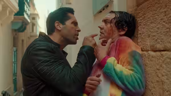 Mike Fallon (Scott Adkins) confronts a man in a colorful jacket in a narrow alley