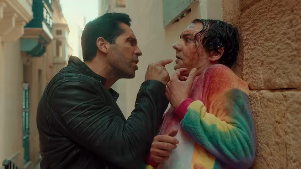 Mike Fallon (Scott Adkins) confronts a man in a colorful jacket in a narrow alley