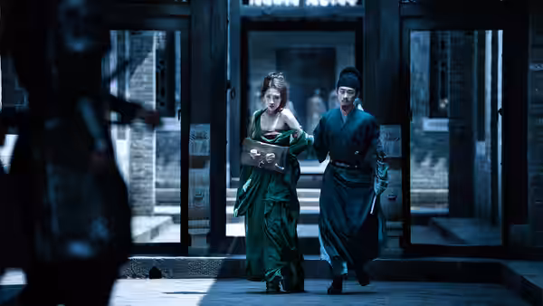 A woman and a man hurry through a doorway as another figure watches