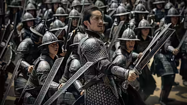 An armored commander turns with his sword amid ranks of soldiers