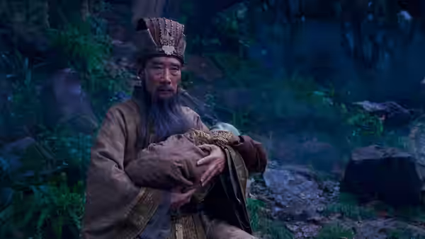 Jiang Ziya (Huang Bo) cradles a bundled infant in a forest