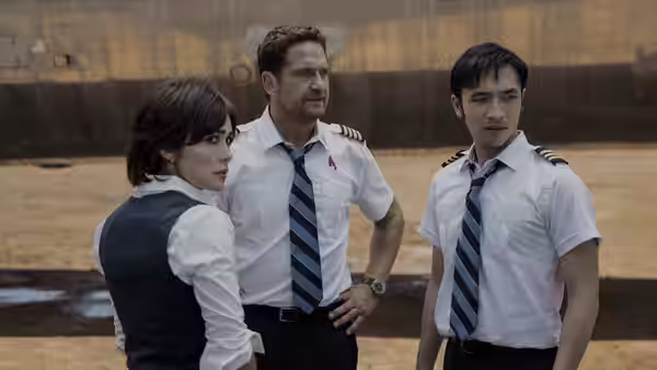 Brodie Torrance (Gerard Butler), Bonnie Lane, and Samuel Dele stand together in pilot uniforms