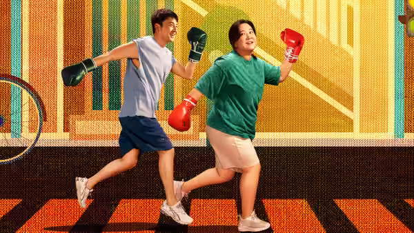 Le Ying (Jia Ling) and Hao Kun (Lei Jiayin) jog playfully in boxing gloves