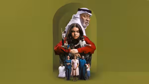A young woman in red stands before an older man’s portrait, with a family gathered below