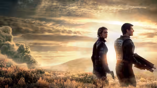 Rita (Emily Blunt) and Cage (Tom Cruise) in a misty field at sunrise