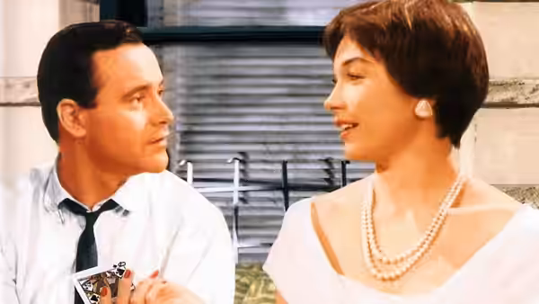 C.C. Baxter (Jack Lemmon) and Fran Kubelik (Shirley MacLaine) looking at each other with cards