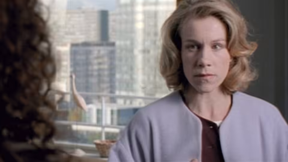 Flora Matlock (Juliet Stevenson) faces someone across an office