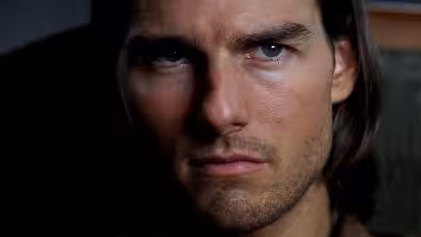 Frank T.J. Mackey (Tom Cruise) in close-up with a serious expression