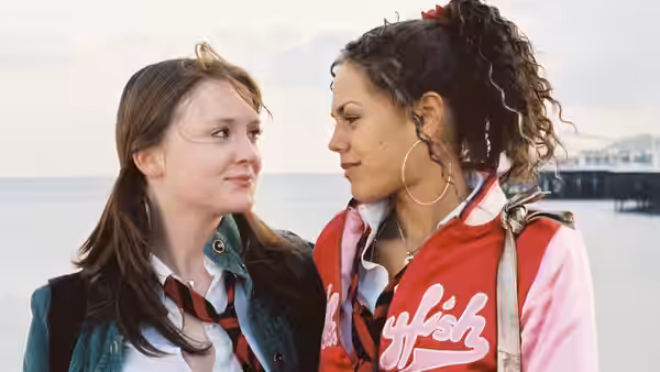Kim (Olivia Hallinan) and Sugar (Lenora Crichlow) face each other by the seaside