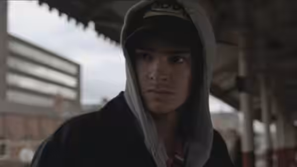 Jack (Andrew Garfield) looks sideways beneath a covered outdoor walkway