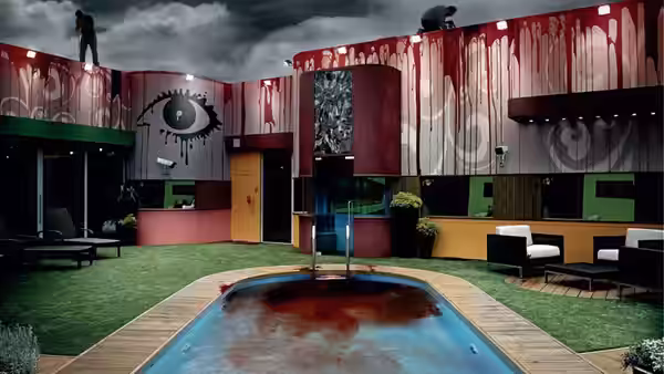 Blood stains the Big Brother garden, pool and walls as figures stand on the roof