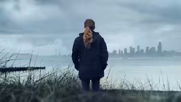 Sarah Linden (Mireille Enos) faces the Seattle skyline across the water