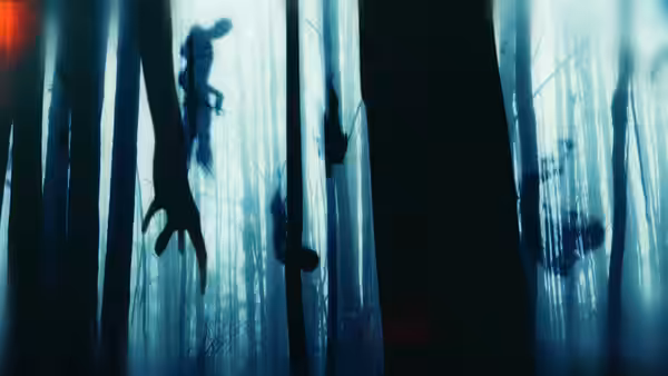 Shadowy human forms hang among dark tree trunks in a blue-lit forest