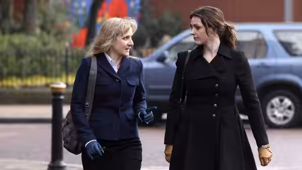 Gill Murray (Amelia Bullmore) and Rachel Bailey (Suranne Jones) walk together along a city street