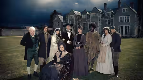 A group of Victorian-dressed residents gathers on the lawn before a country house