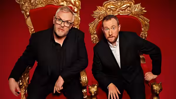 Greg Davies and Alex Horne lean forward from their ornate golden thrones
