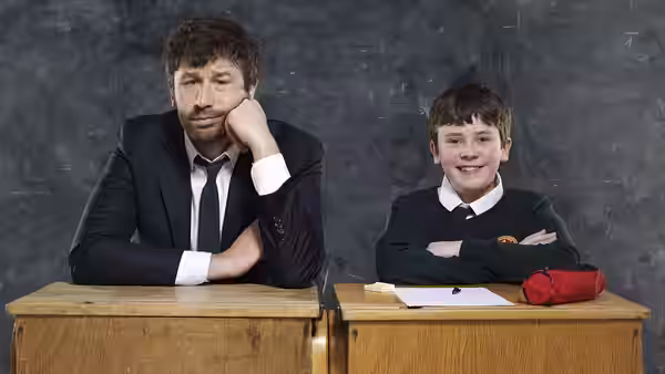 Sean Murphy (Chris O'Dowd) and Martin Moone (David Rawle) sit at adjoining school desks