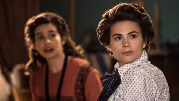 Margaret Schlegel (Hayley Atwell) looks back as Helen Schlegel (Philippa Coulthard) speaks indoors
