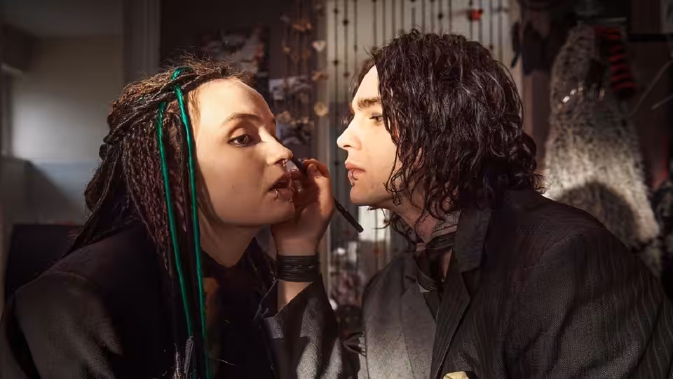 Sophie Lancaster (Abigail Lawrie) applies makeup to Rob Maltby (Nico Mirallegro) in their home