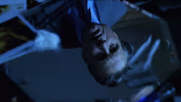 Nicholas Van Orton (Michael Douglas) looks up from the floor among broken glass