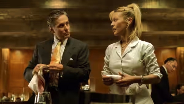 Nicholas Van Orton (Michael Douglas) talks with Christine (Deborah Kara Unger) at a bar