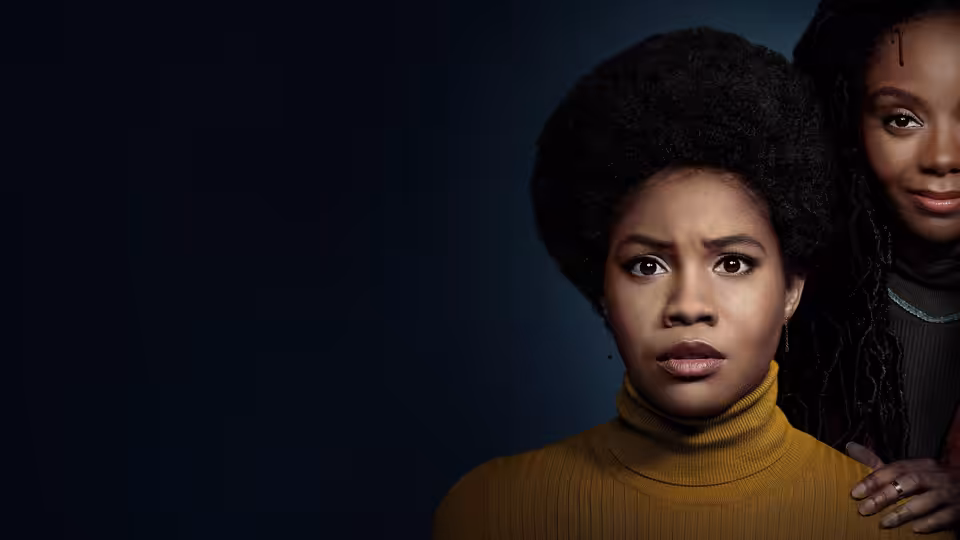 Nella (Sinclair Daniel) stands in front as Hazel (Ashleigh Murray) rests a hand on her shoulder