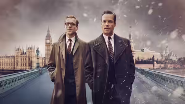 Kim Philby (Guy Pearce) and Nicholas Elliott (Damian Lewis) walk across Westminster Bridge