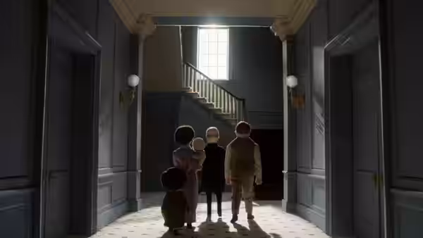 A family enters a grand hallway and faces the staircase beneath a tall window