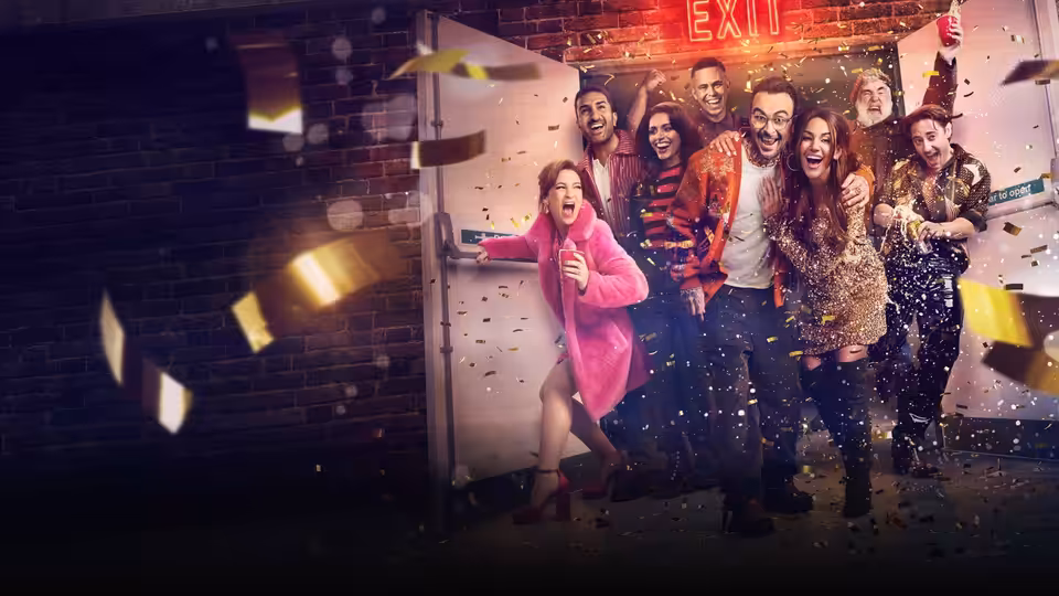 A group of partygoers rushes through an exit as confetti flies