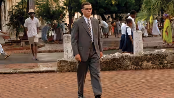 Edward Bell Wilson (Matt Damon) stands in a courtyard among pedestrians