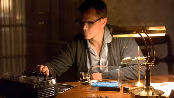 Edward Bell Wilson (Matt Damon) operates a reel-to-reel recorder at his desk