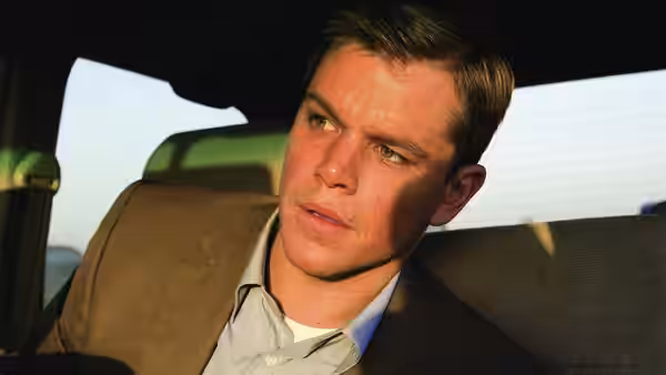 Bryan Woodman (Matt Damon) sits in the back of a car