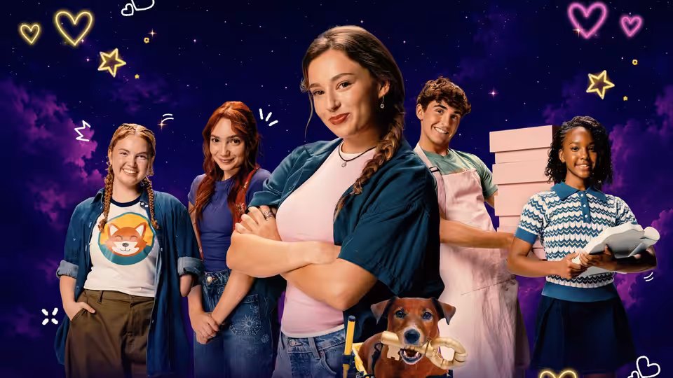 A group of young people pose with a dog against a starry illustrated backdrop