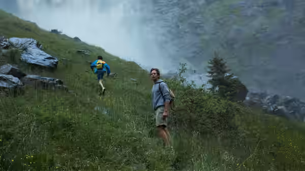 Oliver (Armie Hammer) watching Elio (Timothée Chalamet) run up a misty hillside