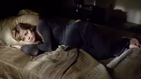 Isabella Fields El-Ibrahimi (Reese Witherspoon) lies curled on a bed