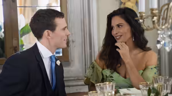 Jack (Sam Claflin) talks with Dina (Olivia Munn) at the wedding banquet