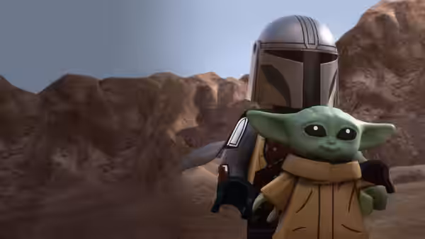 The Mandalorian carries Grogu through a rocky desert landscape