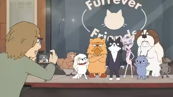 A photographer takes a picture of Kevin and a group of cats and dogs