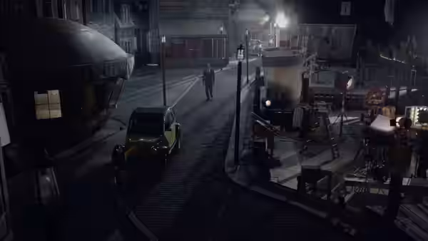 A lone figure walks along a cobblestone street beside a parked car and tram