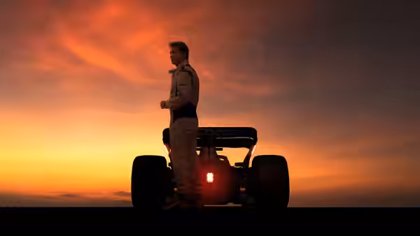 A racer in a white suit stands beside a Formula One car at sunset