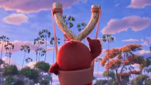 Red stands facing a wooden slingshot above a tropical landscape