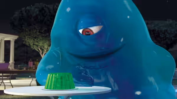 B.O.B. studies a green gelatin dessert on a table outdoors at night