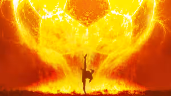 A martial artist kicks against a towering fireball