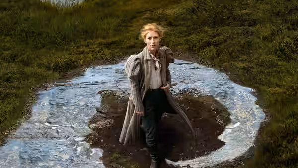 Cora Seaborne (Claire Danes) stands in a muddy clearing surrounded by a ring of water