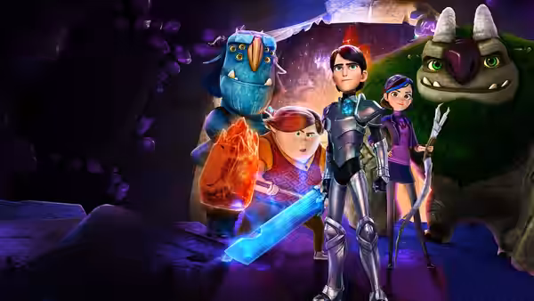 Toby holds a glowing crystal as Jim, Claire and Blinky face forward in a cavern