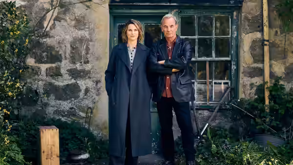 DI Rose O'Connell (Liz White) and Joe Ruby (Robson Green) stand outside a stone cottage
